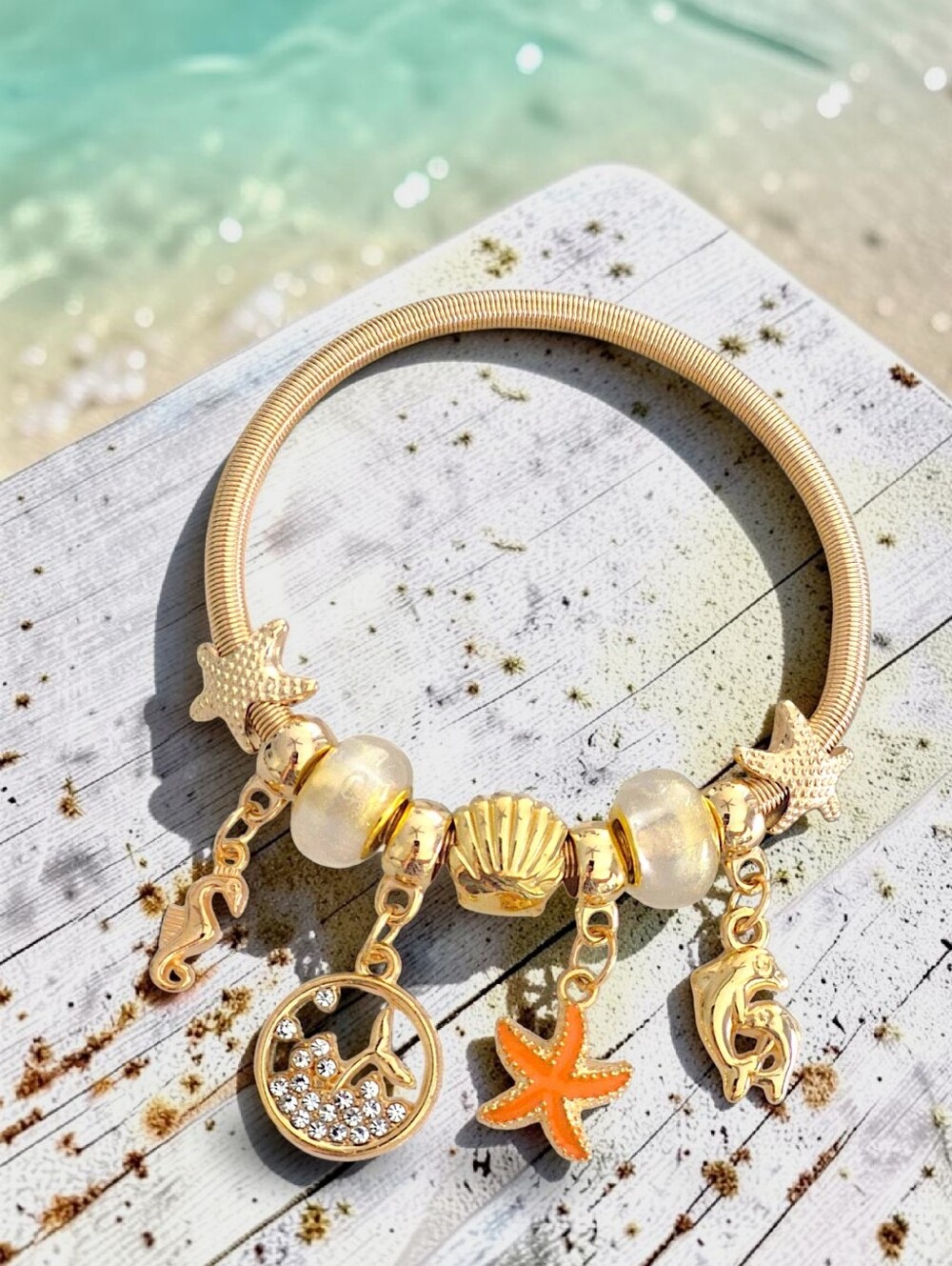 Gold Ocean Charm Bracelet with Orange Starfish